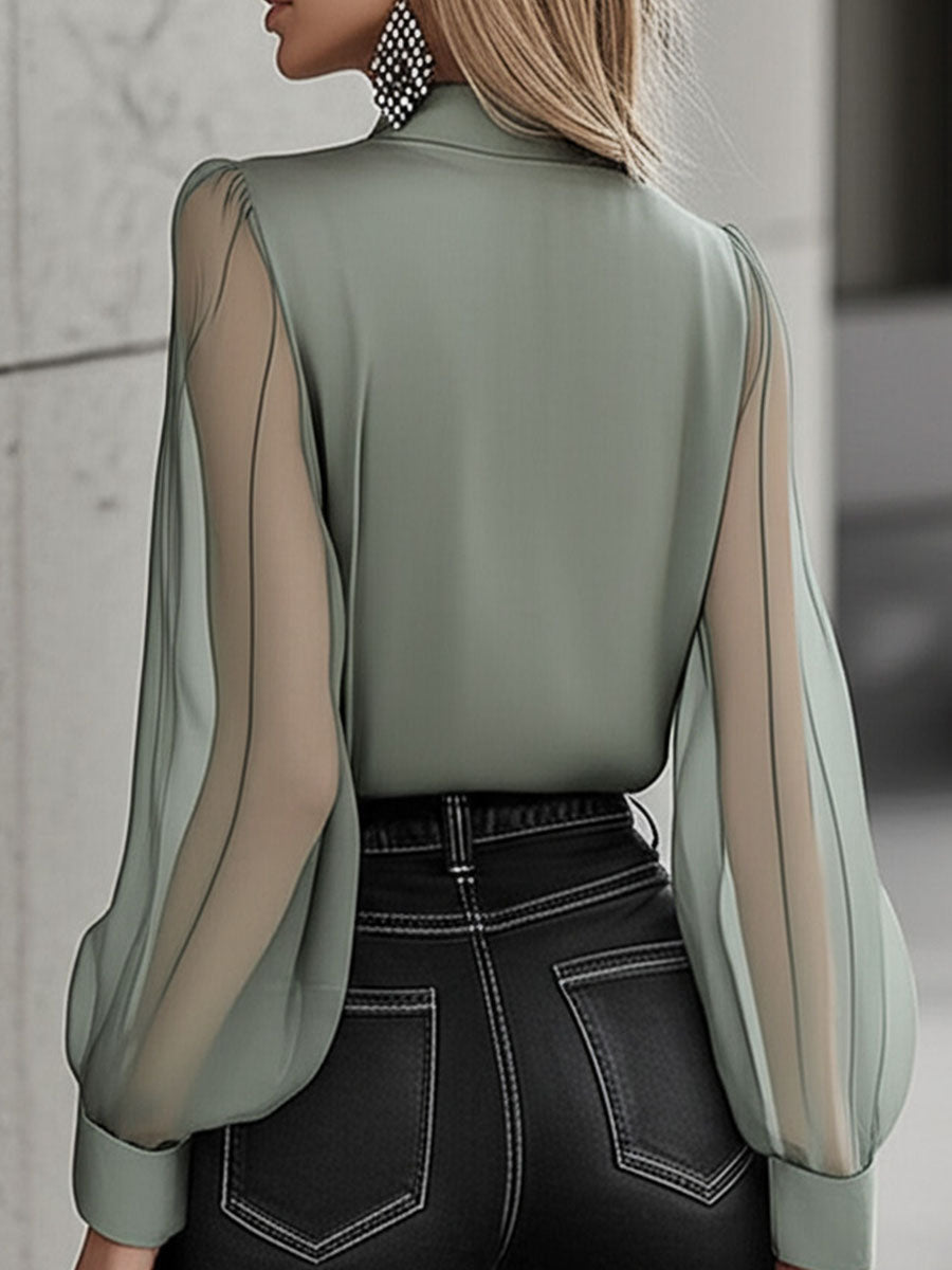 Camisa elegante y atemporal de manga transparente con botones